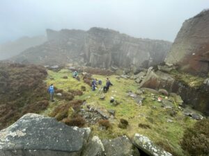 Students on an outdoor activity on a misty moorland